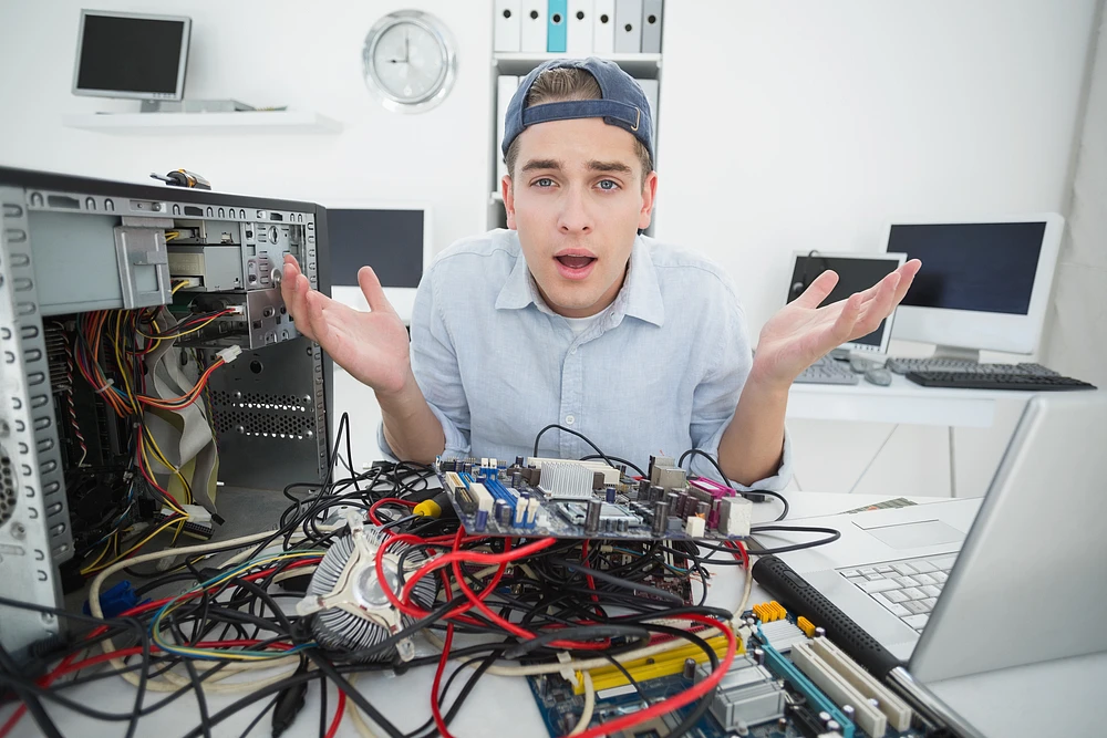 A confused programmer trying to fix his computer