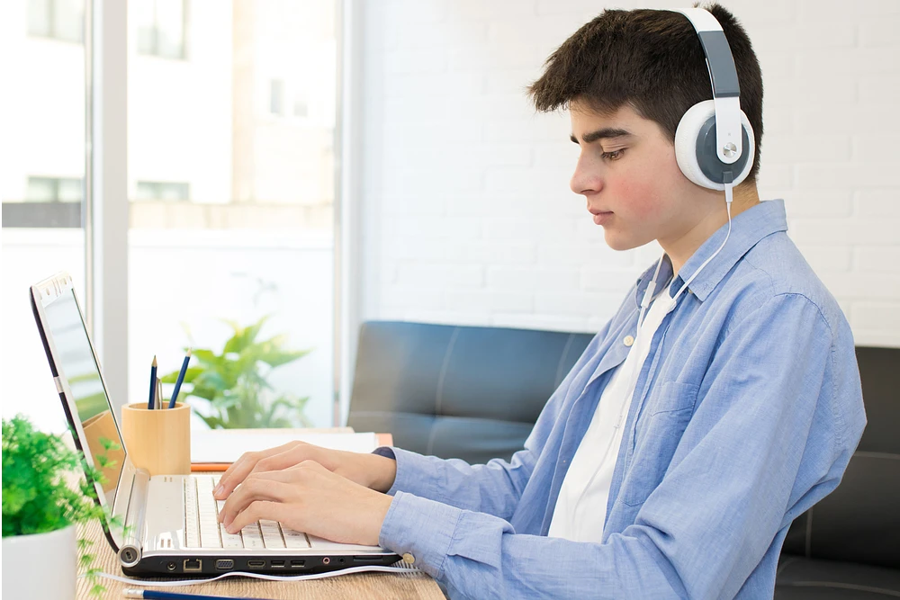 A teenage programmer playing Music to reduce stress