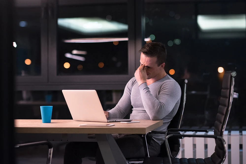 A stressed front end developer at work